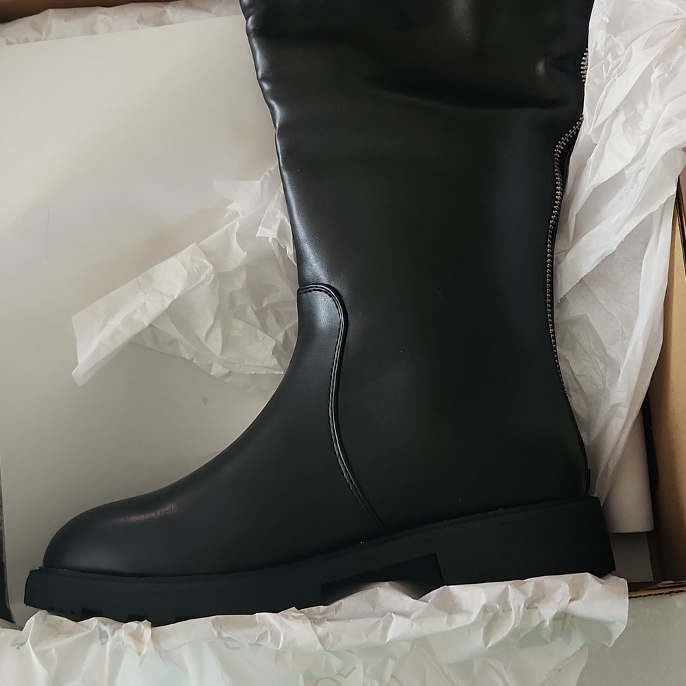 Black flat over the knee boots